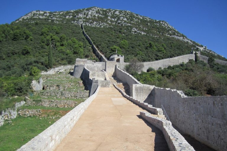 The Ston defensive walls climbing the hillside